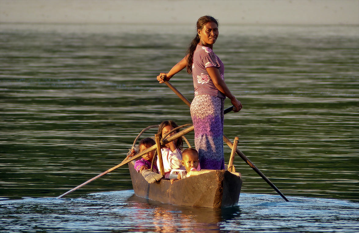 Family in boat in Myanmar.
