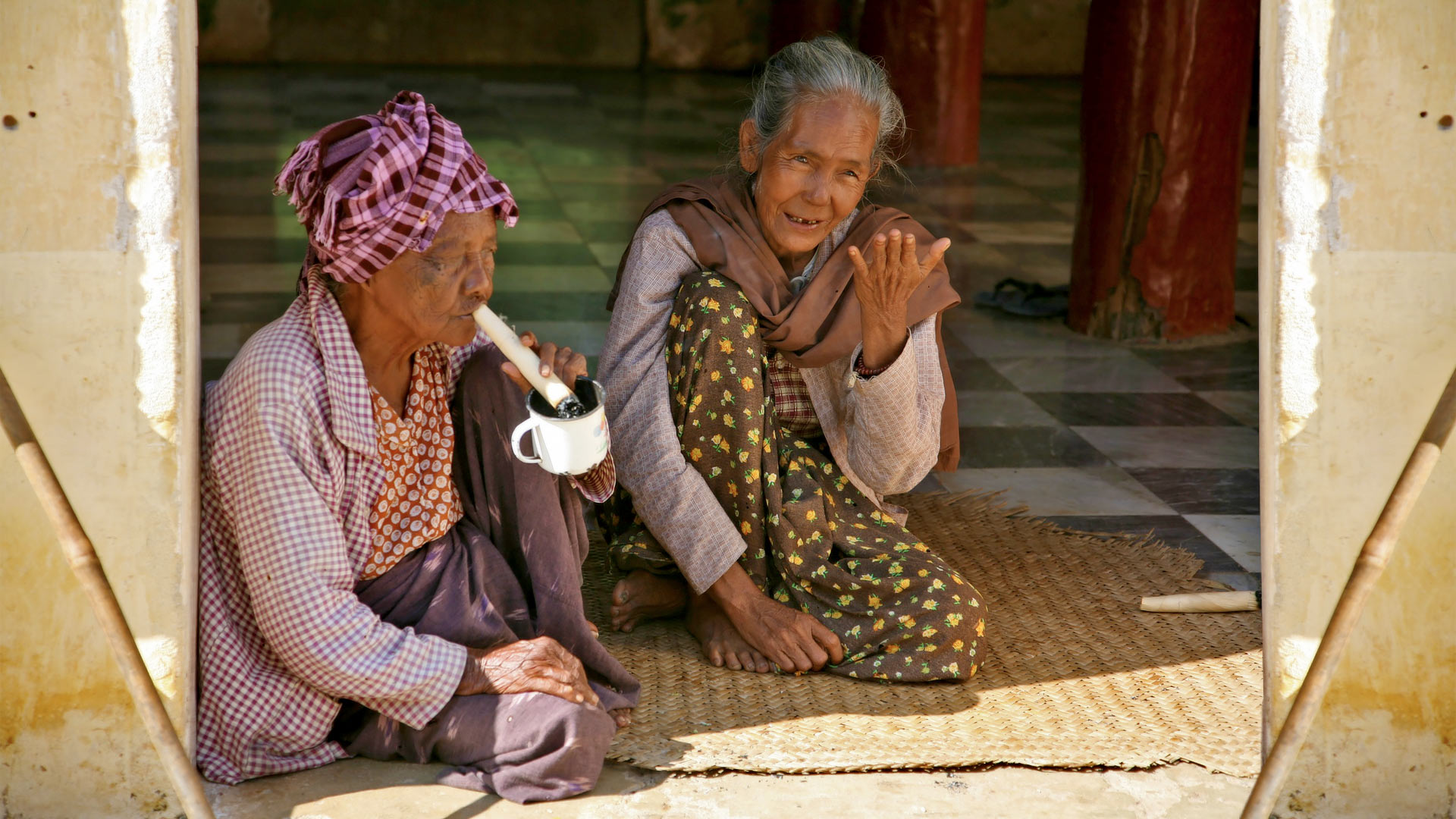 Myeik women smoking in Myanmar.
